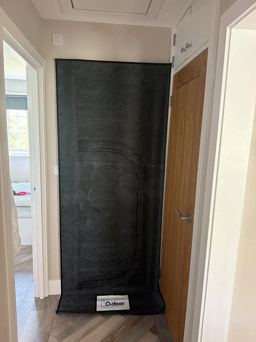 Odoor Isolation Door Cover fitted over an internal doorway in a hallway