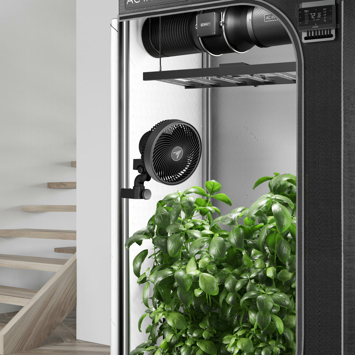 AC Infinity CloudRay Manual Clip Fan clamped to a grow tent pole above the plants