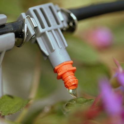Hygrozyme HyClean Line Cleaner in use — clean drip emitter on an irrigation line